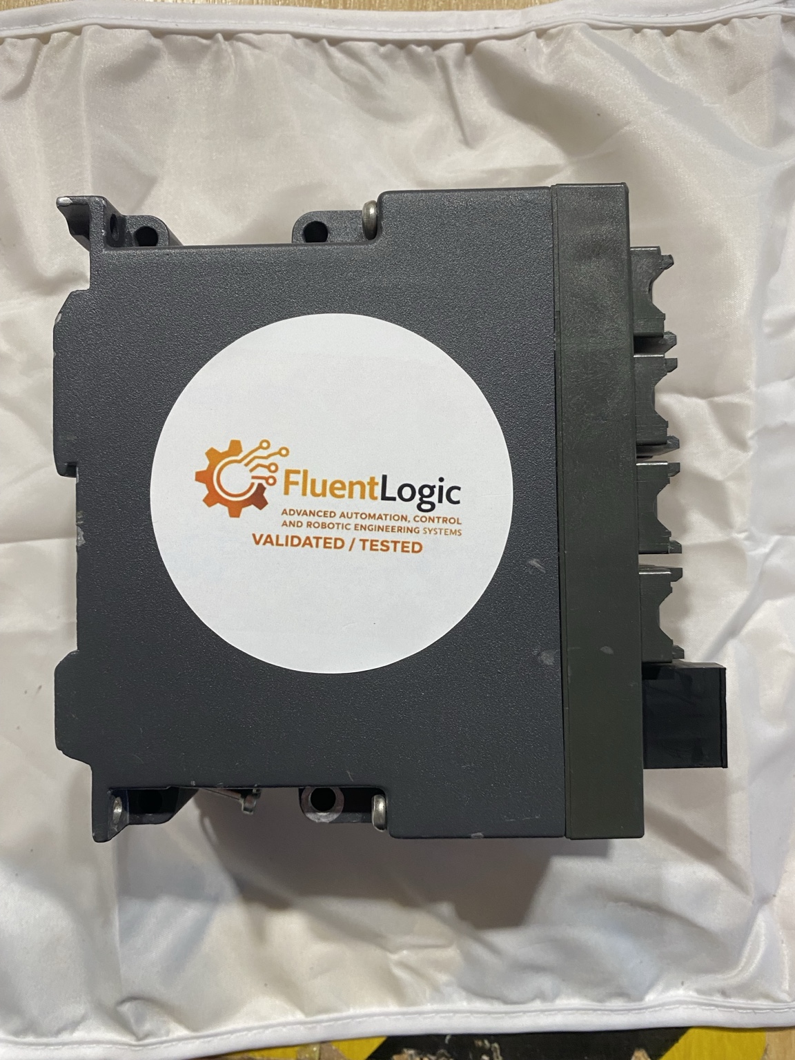 Industrial component bearing a FluentLogic validated and tested label